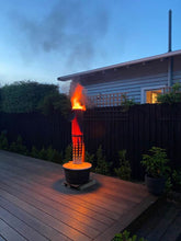 Load image into Gallery viewer, Frost pot in urban setting as outdoor heater. Note spacer under frost pot to protect the timber deck.